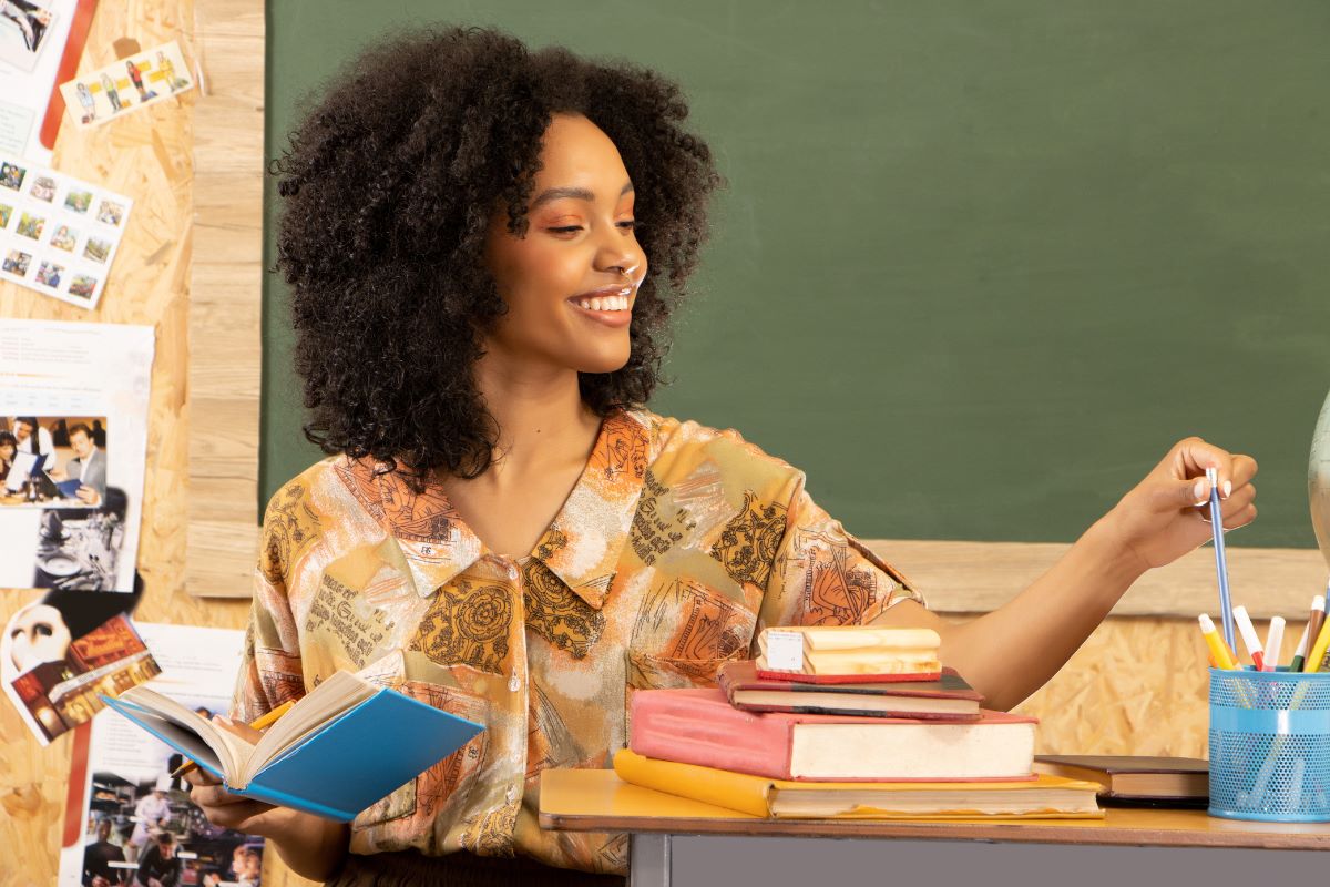 Female teacher at the chalkboard